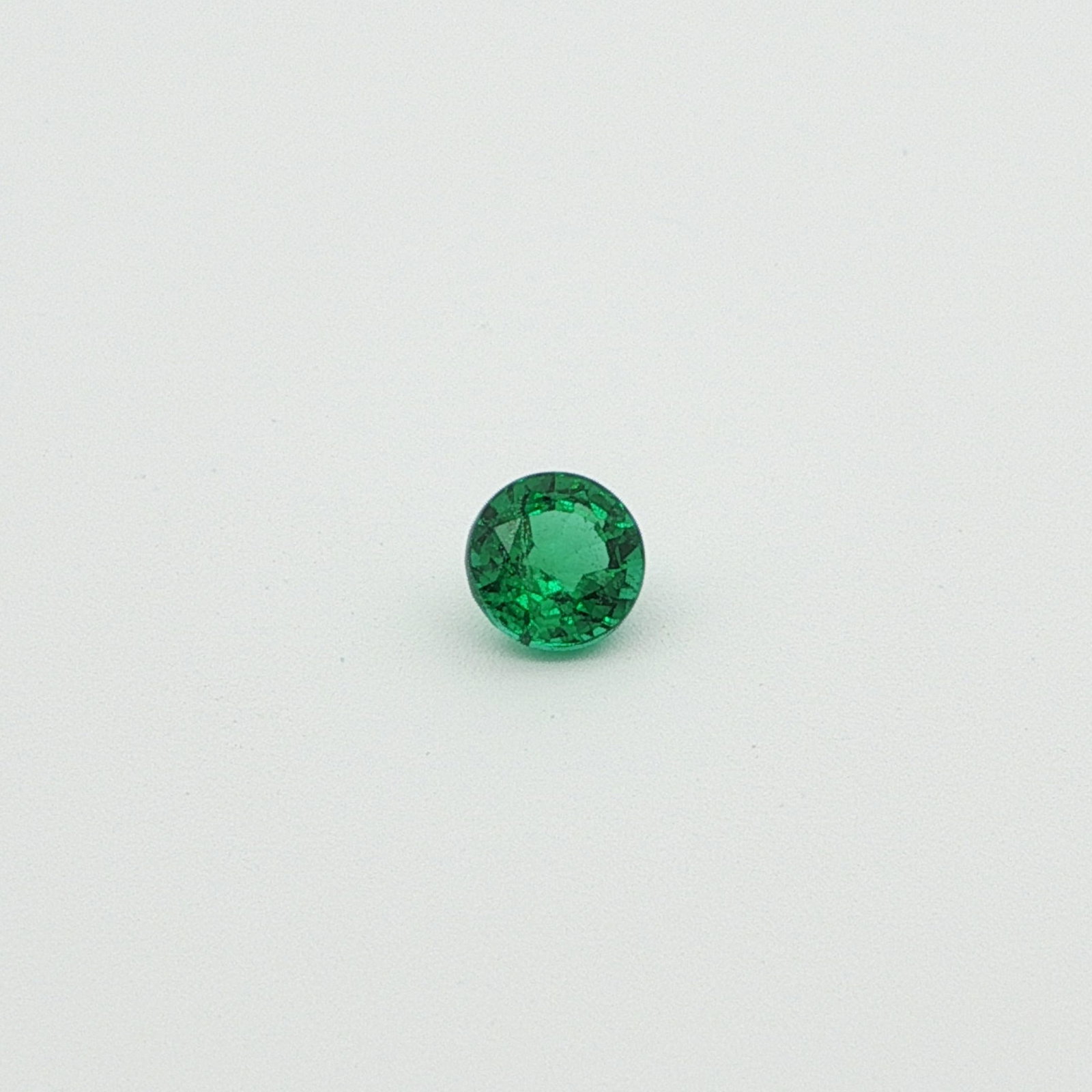0.56 Carat Round Emerald